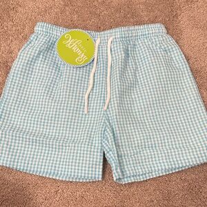 Blue (aqua) Gingham Swim Shorts
Classic whimsy NWT SIZE 7